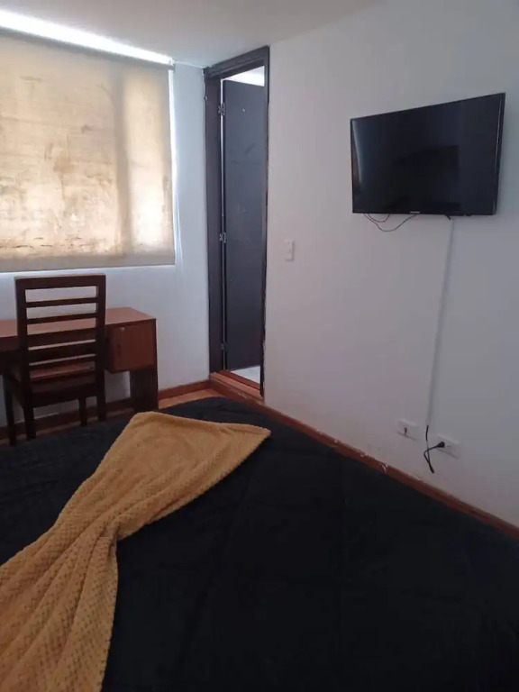 Room in Guest Room - Charming and Cozy Stay in Bogotá's Heart Perfect for Travelling Families!
