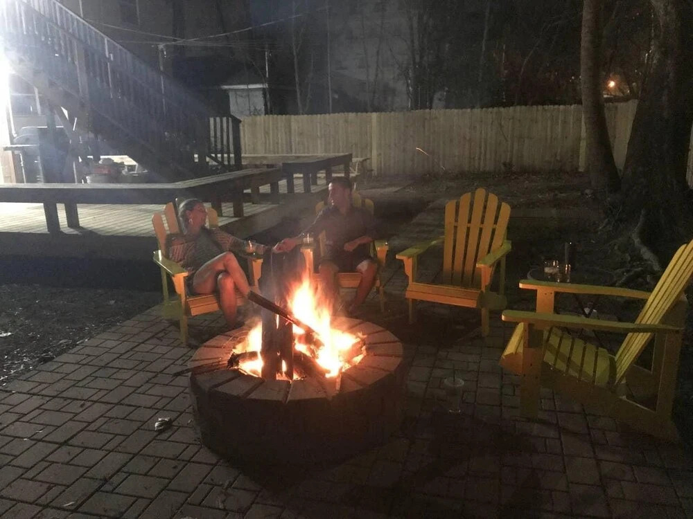 Vibrant, Colorful Condo Building With Backyard Firepit and Games