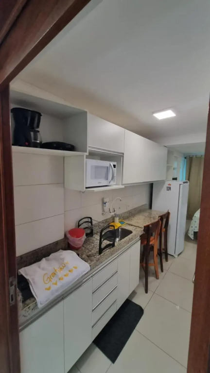 Confortável Flat com piscina de borda infinita na cobertura
