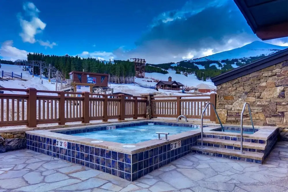 Expansive 4 Bedroom Ski in, Ski out One Ski Hill Residence Located at the Base of Peak 8 with Beautiful Views