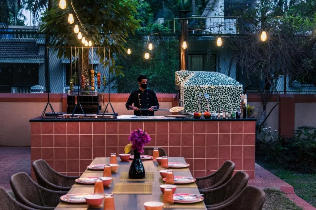 SaffronStays Casa Del Palms - 8BR luxury pool villa with gazebo, pickleball, bar & lawns near Nagaon Beach