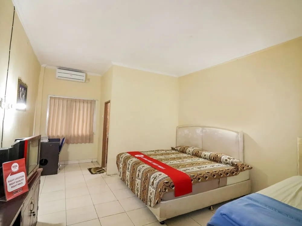 Nida Rooms 9 Kraton Tugu Railway Station at Hotel Queen Star
