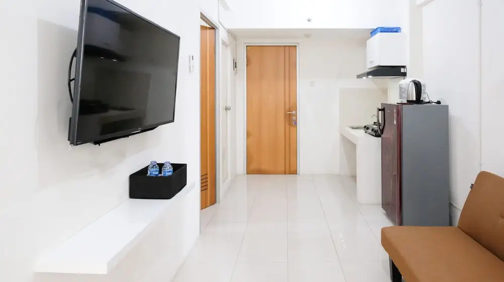 Homey 2BR at Puncak Permai Apartment By Travelio