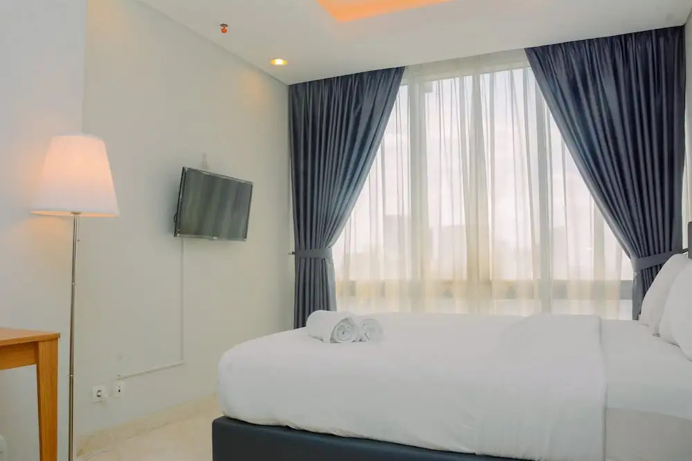 Comfy and Spacious 2BR The Masterpiece Epicentrum Apartment By Travelio
