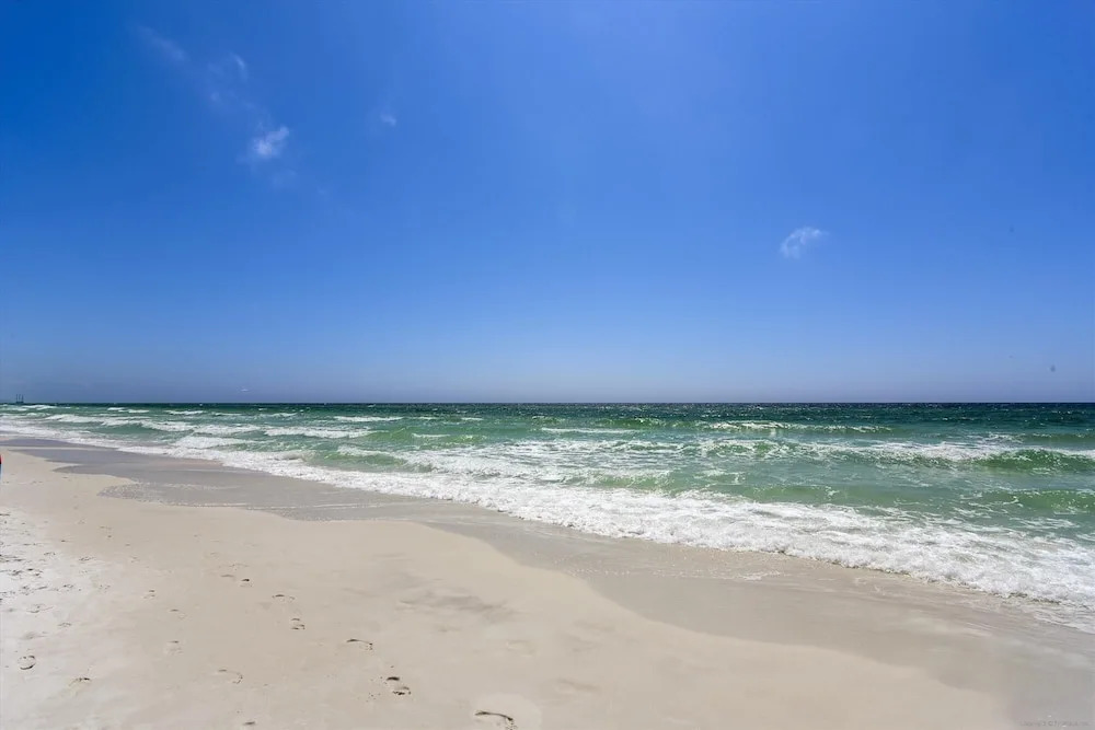 Silver Beach 506 is a gorgeous Gulf Front 4 BR with free beach service - sleeps 8 by RedAwning
