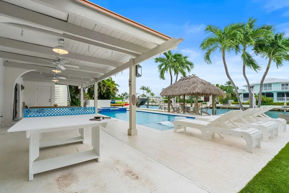 Deep Blue Waterfront Gem Pool Kayaks Dock