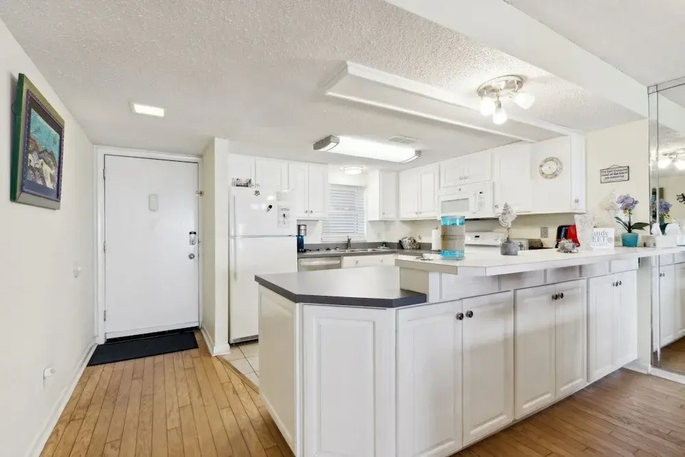 Oceanfront Beach Condo with Private Balcony, Short Walk to Pool and Beach by RedAwning