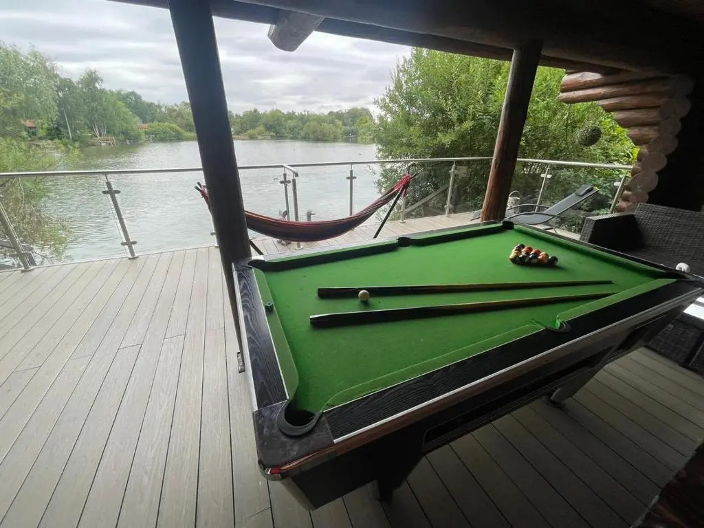 Woodpecker Log Cabin with hot tub, pizza oven bbq entertainment area, lakeside with private fishing peg situated at Tattershall Lakes