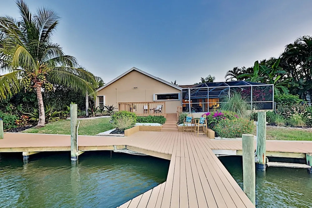 Canal-front W/ Boat Dock & Screened Pool 4 Bedroom Home