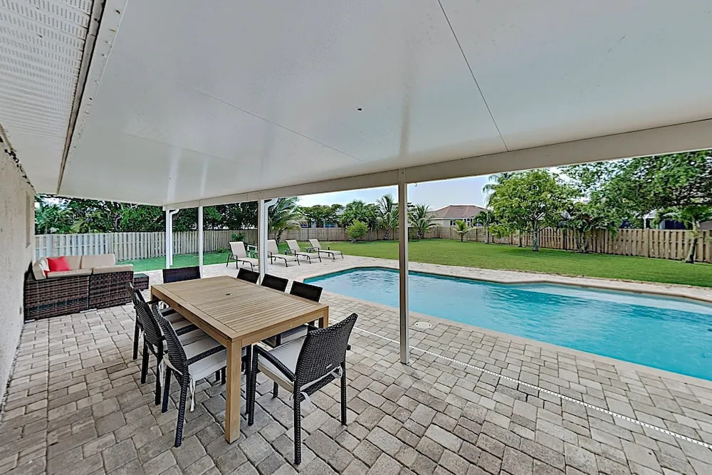 Stylish Tropical Getaway W/ Pool & Oversized Yard 3 Bedroom Home