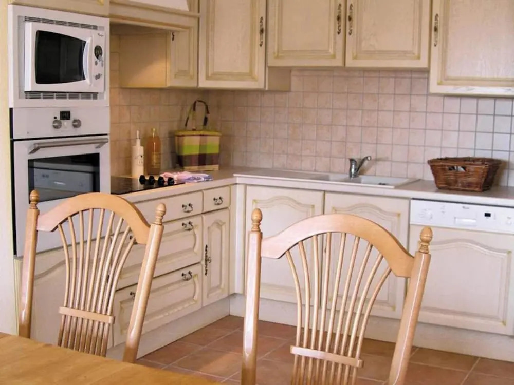 Semi-detached villa with dishwasher, close to the village