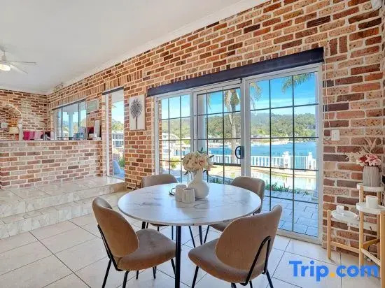 Stunning 4BR Holiday Home with Water Views & Pool