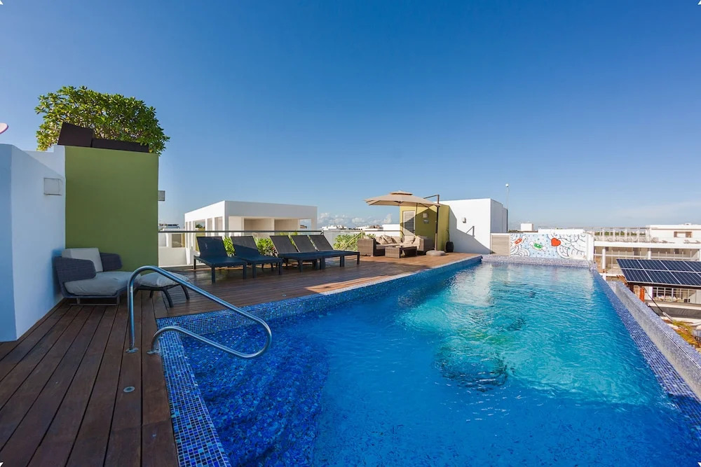 Fun and Relaxing  2BR PH steps away from the beach by Happy Address