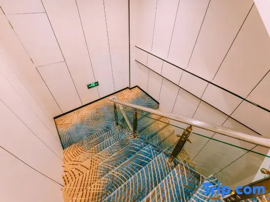 Qingmu Hotel (Nanjing Pukou Information Engineering University Subway Station Yangxin Road)