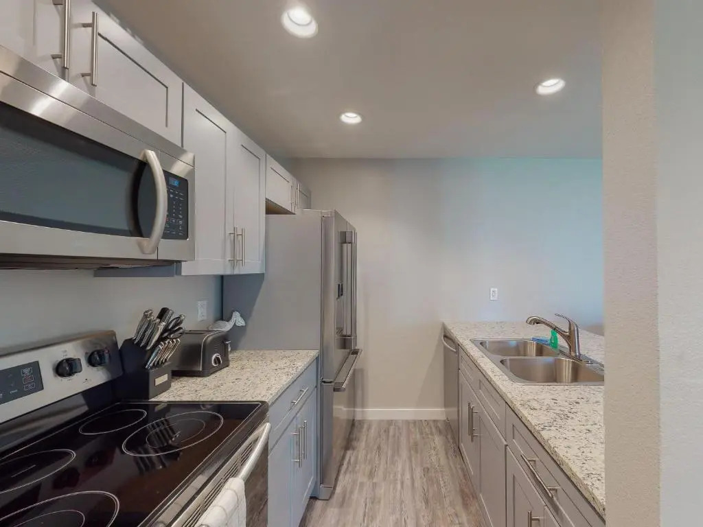 AH-E117 Remodeled First Floor Condo, Across From The Shared Pool & Hot Tub, Near Marina & Ferry