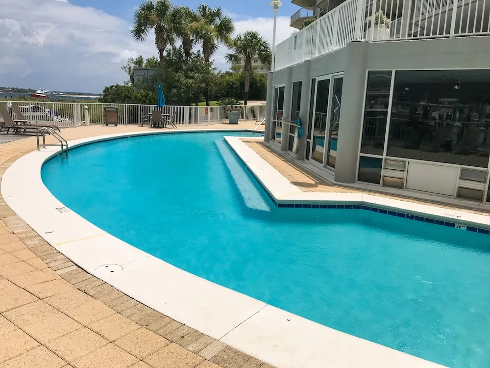 Stylish Bay-view Getaway W/ Pools, Hot Tub & Dock 3 Bedroom Condo