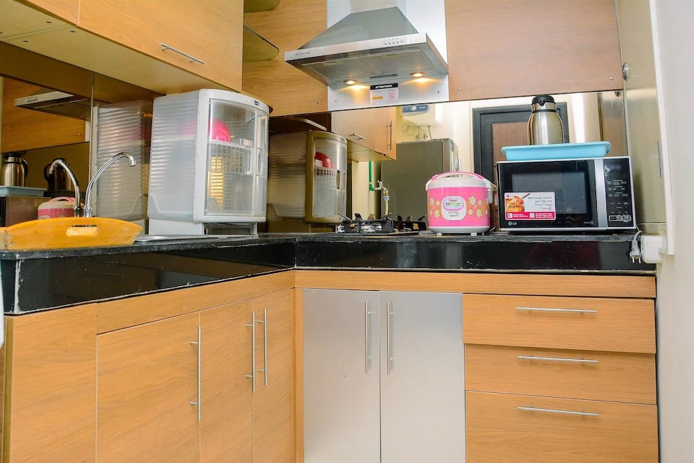 Modern and Luxurious 2BR Essence Dharmawangsa Apartment By Travelio