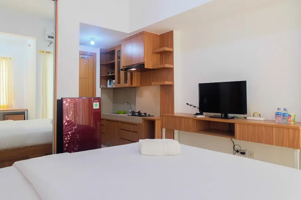 Brand New Compact Studio The Nest Puri Apartment By Travelio