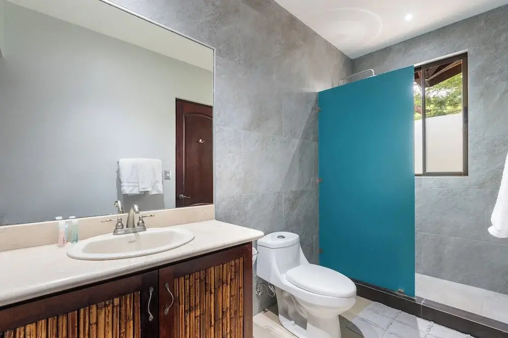 Modern Island-Themed Condo with Floor-to-Ceiling Windows & Garden and Pool Views Within Walking Distance of the Beach