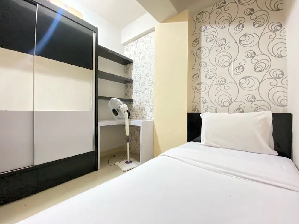 Cozy 2BR at Pinewood Apartment By Travelio