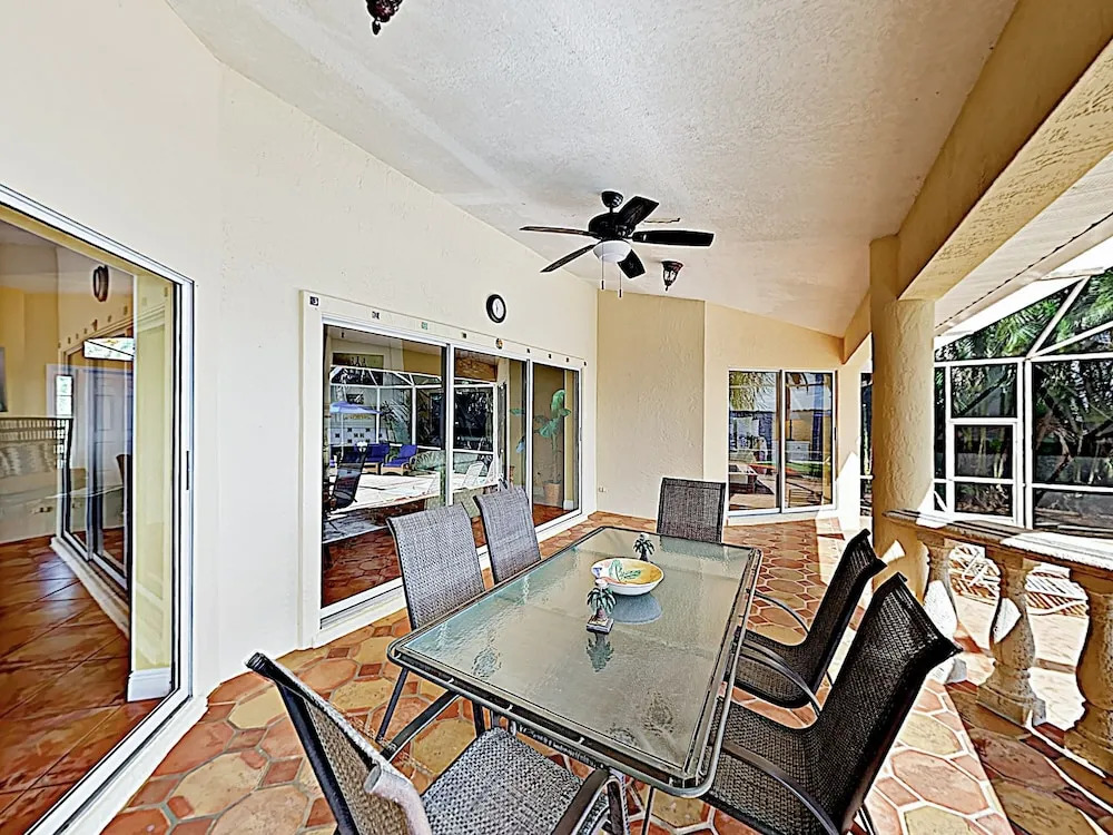 Riverfront Paradise W/ Caged Pool, Hot Tub & Dock 3 Bedroom Home