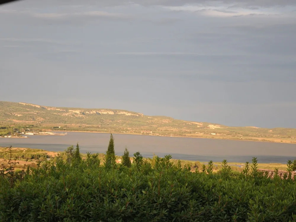 Holiday villa near Narbonne-Plage, fenced private swimming pool and view of a lake
