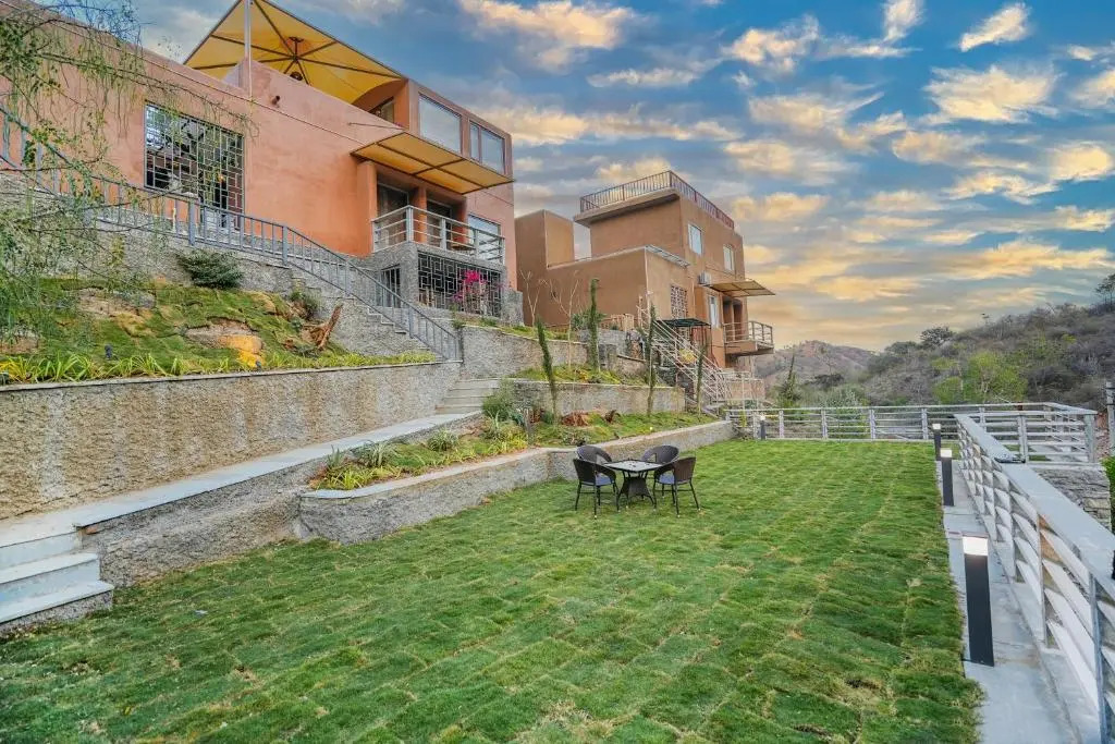 SaffronStays Moringa WishingTree - 3-BR villa near Nathdwara with pool, lawn and hillside views
