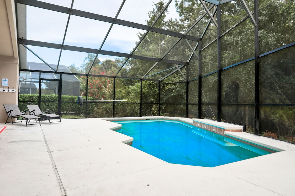 Stylish Retreat With a Private, Heated Pool, Central AC, & Garage Game Room