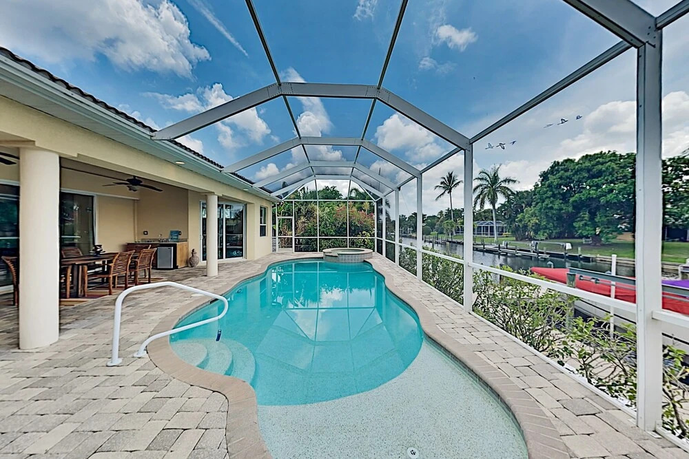Upscale All-suite Canal W/ Dock & Fireplace 4 Bedroom Home