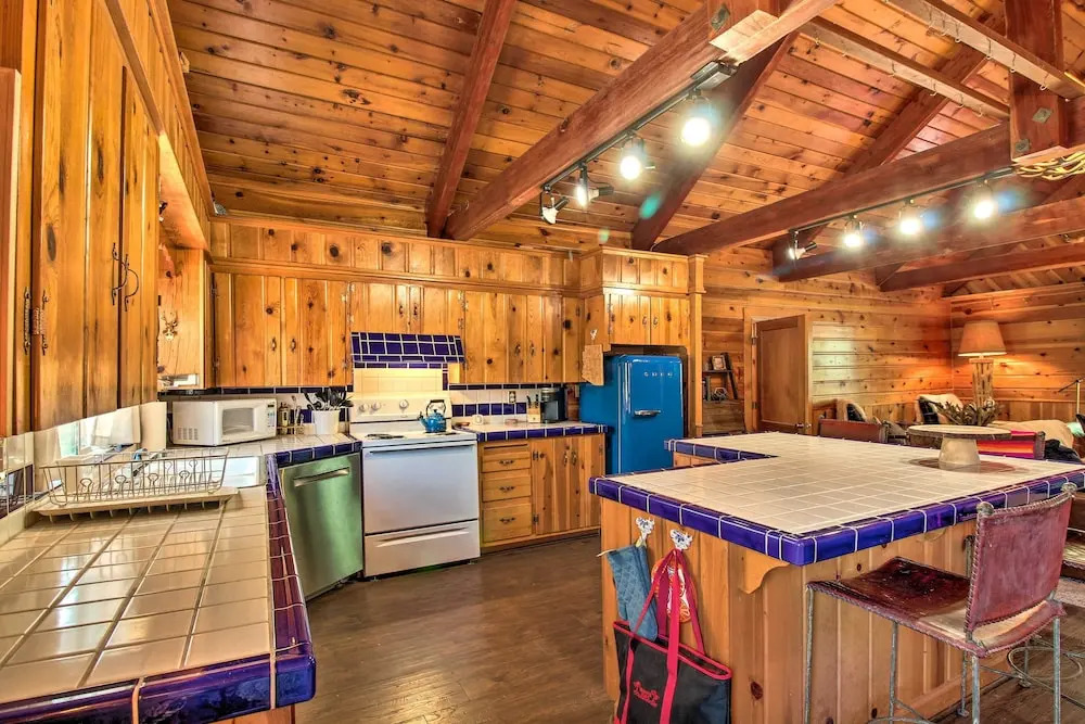 1 Mi to Rainbow Lake: Lakeside Cabin w/ Deck!