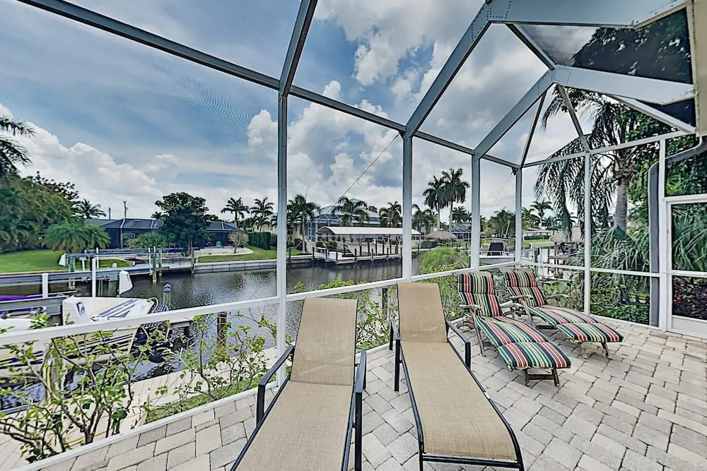 Upscale All-suite Canal W/ Dock & Fireplace 4 Bedroom Home