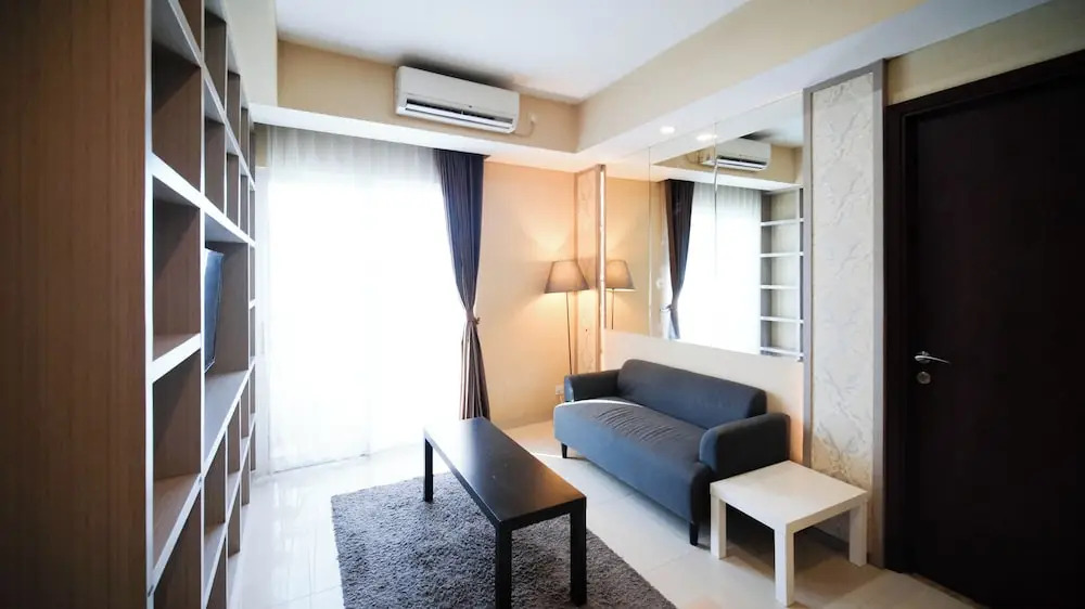 Modern and Cozy 1BR at Grand Sungkono Lagoon Apartment By Travelio
