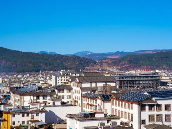 Yuxue Qingcheng Snowview Boutique Inn(御雪晴城·Starrysky日照金山观景美宿（丽江古城大水车店）)
