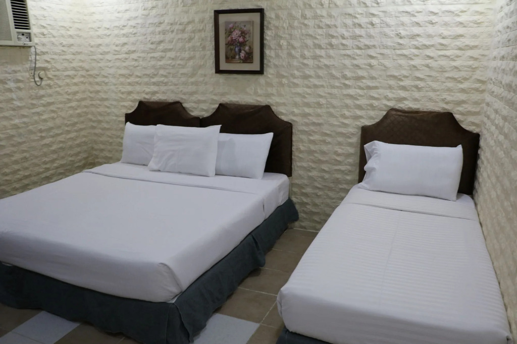 Al Alya Hotel Rooms and Suites
