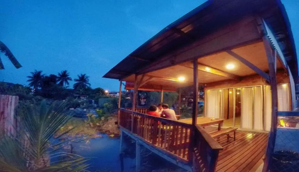 Tungs Tropika - With a Wooden Hut by a Lake