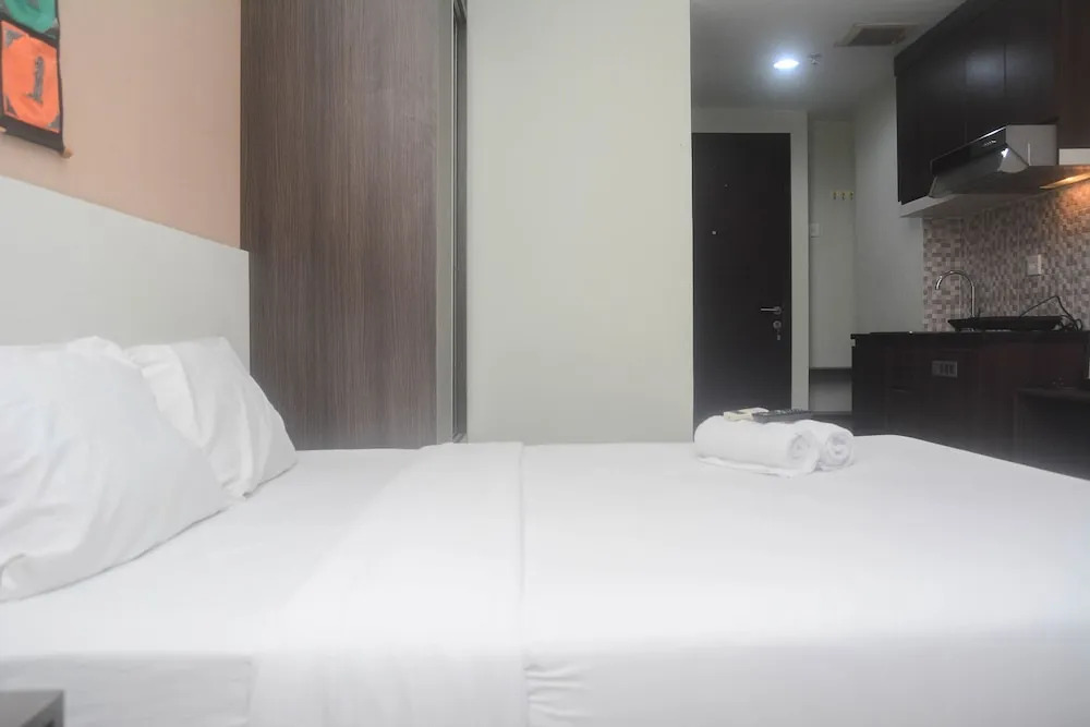 Minimalist and Comfy Studio at Grand Dhika City Apartment By Travelio