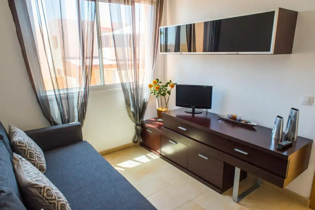 Family Apartment Delfines in Heart of Corralejo- Only 1 min to Sea, with Pool & Free Wifi by Holidays Home