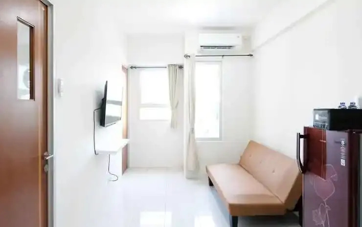 Homey and Modern 2BR at Puncak Kertajaya Apartment By Travelio