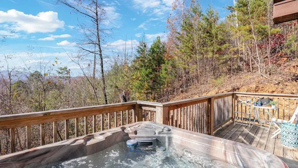 Hot Tub, Game Loft, Open Living, Minutes to Downtown Gatlinburg Whisper Cabin by Avantstay