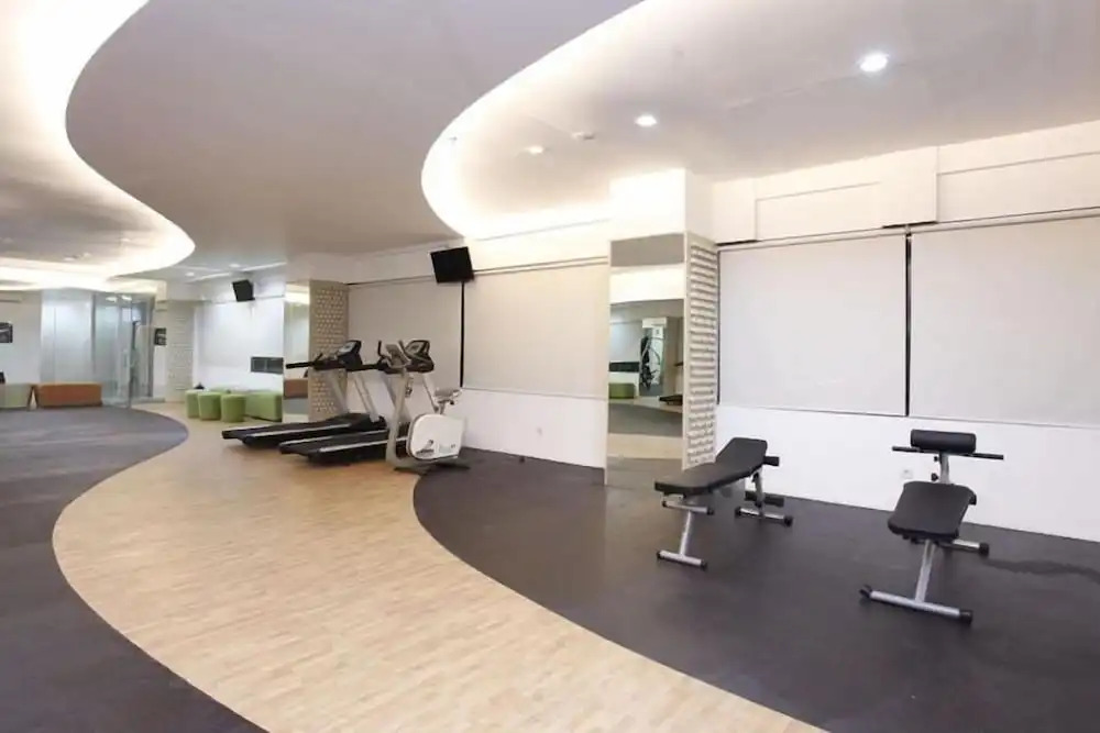 Modern Studio Grand Serpong Apartment By Travelio
