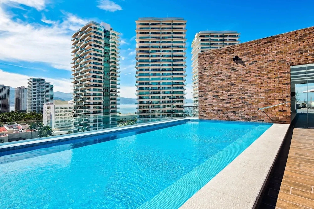 5th-floor Condo With Partial Ocean Views, Heated Pool, Sauna, Gym, Balcony, W/D
