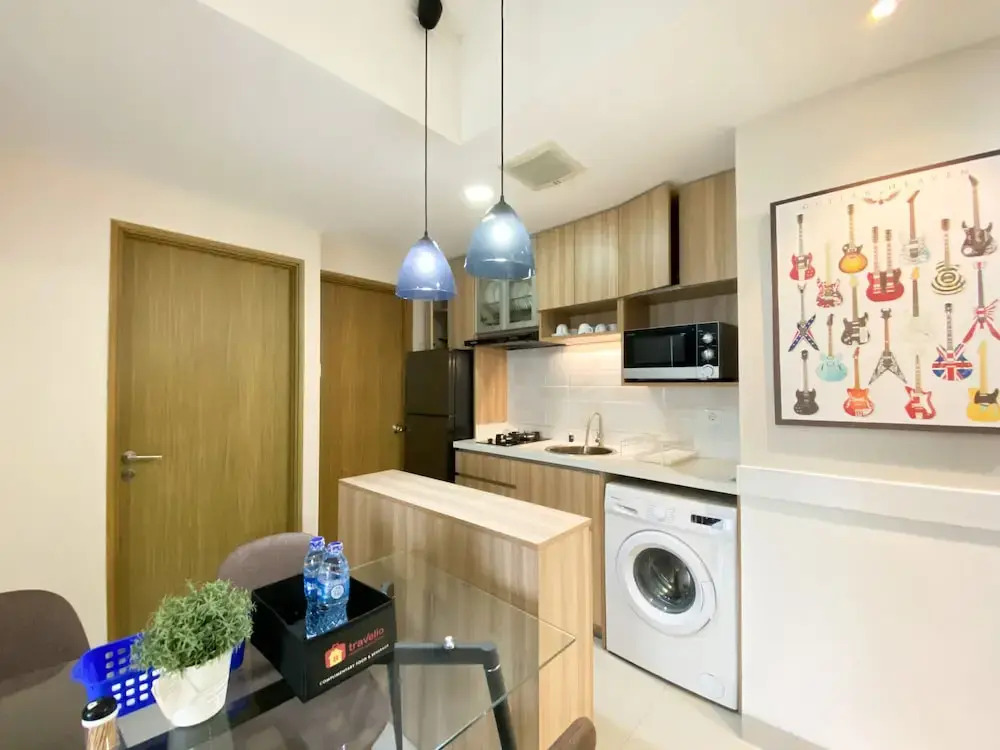 Cozy and Minimalist 2BR at 8th Floor The Oasis Cikarang Apartment By Travelio