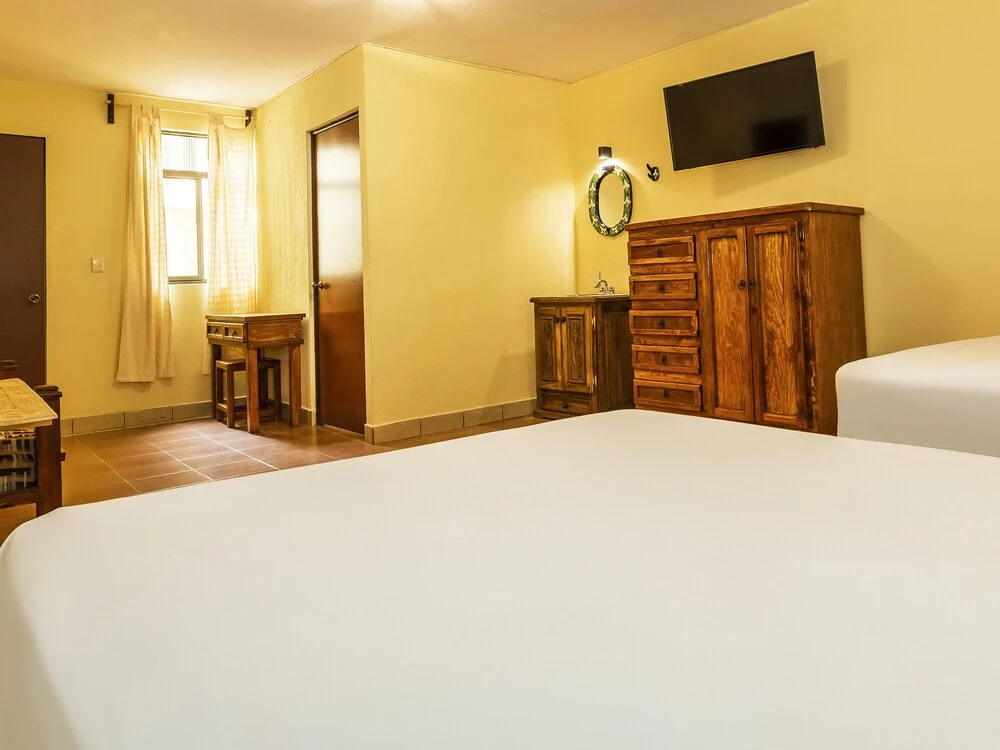 Capital O Las Calzadas Hotel & Suites