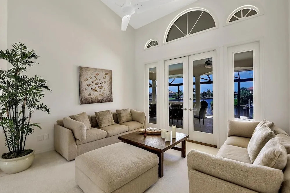 Serene waterfront home with pool, spa, and water view