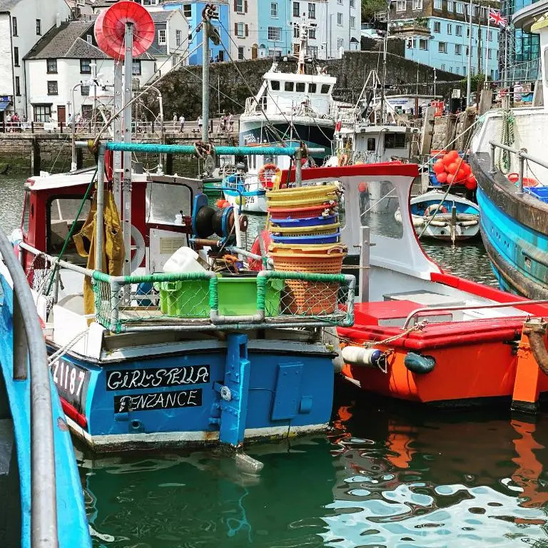 LOBSTER POT APARTMENT with stunning harbour and sea views and free parking for one car & pet friendly