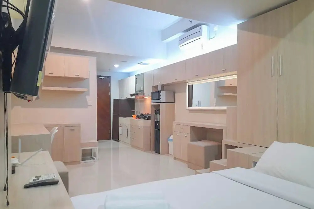 Best Homey and Modern Studio at Uttara The Icon Apartment By Travelio