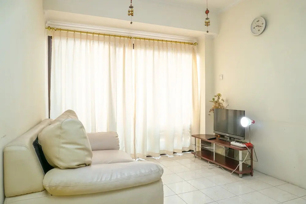 Clean and Homey 1BR at Puri Garden Apartment