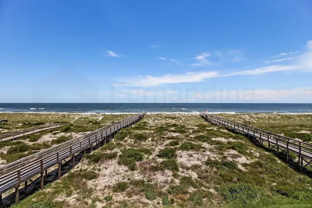 Newly Remodeled Oceanfront Condo with Salt Water Pool and Private Walkway to Beach by RedAwning