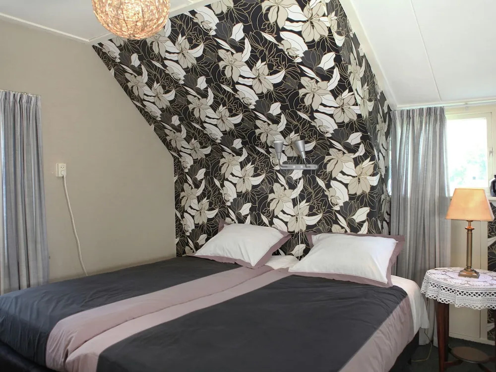 Holiday Home With Roofed Terrace, Barbecue & Garden in Bentelo