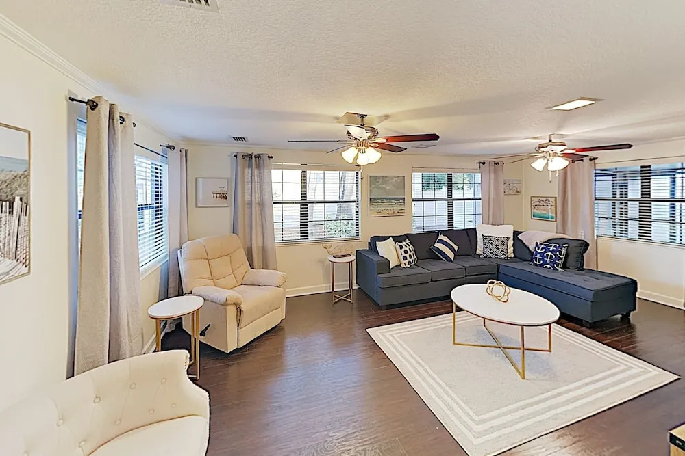 Updated W/ Gated Pool & Screened-in Porch 4 Bedroom Home